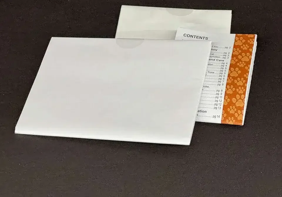 Folded Paper Inserts with tabs on top to hold together, the middle paper insert displays the word contents and puppy paws on the side with an orange background