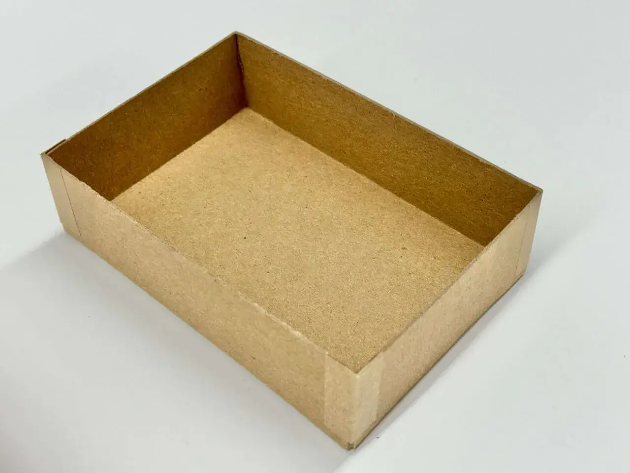 A chipboard tray in a white background
