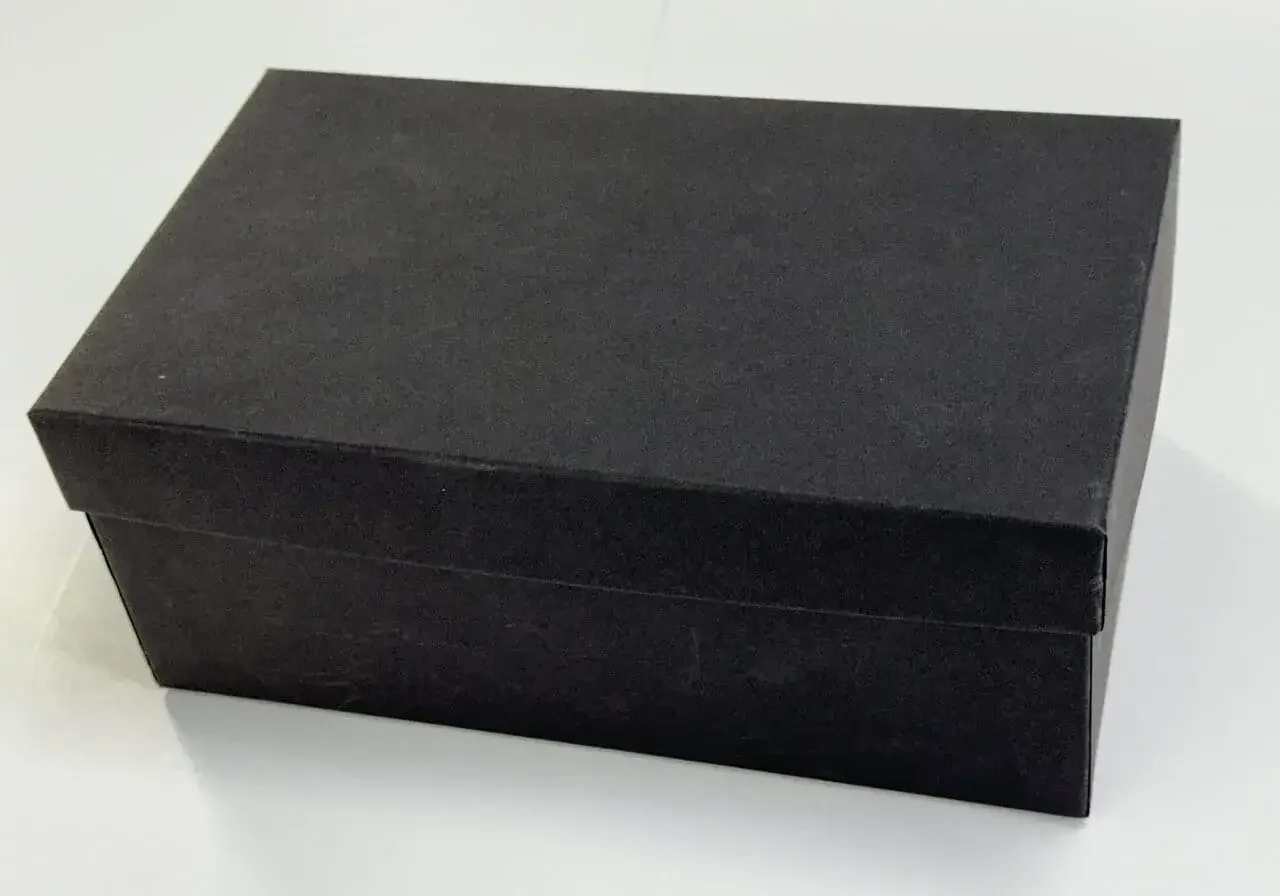 Black Shoebox styled rigid two-piece box with white background.
