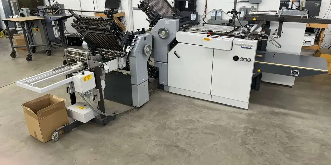 Stahlfolder within a factory setting with concrete floors and white walls.